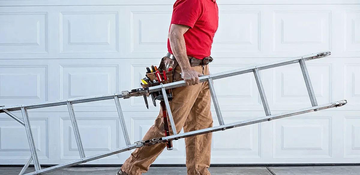 Garage door repair technician arriving with tools and ladder in San Antonio, TX